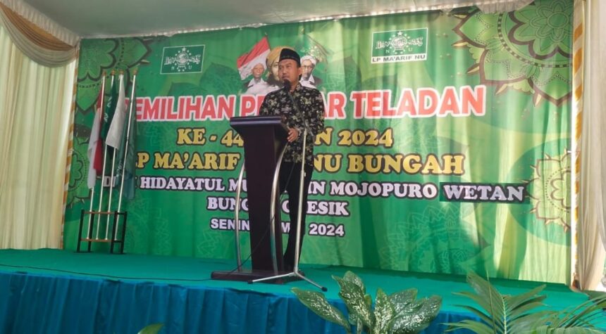 Ketua MWCNU Bungah KH Muhammad Alauddin, saat memberikan sambutan gelaran Pemilihan Pelajar Teladan LP Ma'arif MWCNU Bungah, Senin (20/5/2024). Foto: Azharur Rofiqi/NUGres