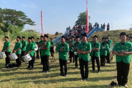 Korps Musik (Korsik) Pimpinan Ranting GP Ansor Tebuwung kembali bertugas dalam Upacara Peringatan Detik-detik Proklamasi Kemerdekaan RI yang digelar oleh Pemerintah Kecamatan Dukun Gresik, Sabtu (17/8/2024). Foto: dok PAC GP Ansor Dukun